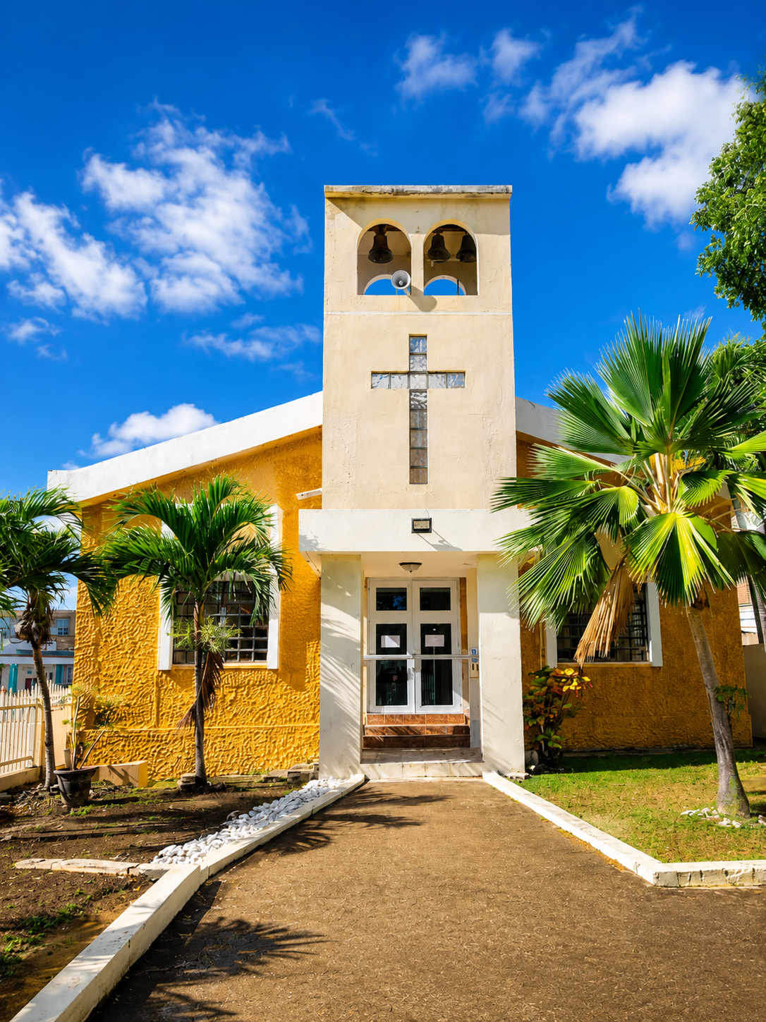 Parroquia Nuestra Señora del Carmen, the yellow Catholic church with bell tower and cross in downtown Culebra, Puerto Rico