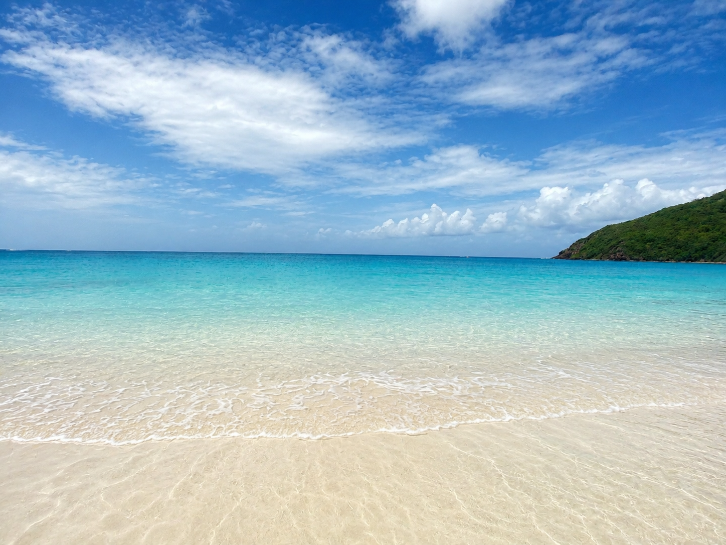 Peaceful stretch of Flamenco Beach at low tide