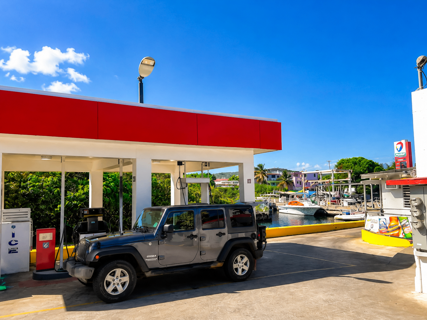 Dakiti Gas Station β Puma fuel station overlooking Ensenada Honda with a Jeep at the pump