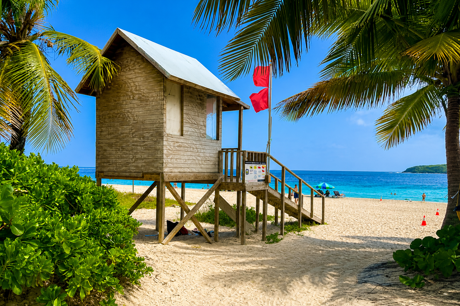 Lifeguard station framed by palms at Flamenco Beach