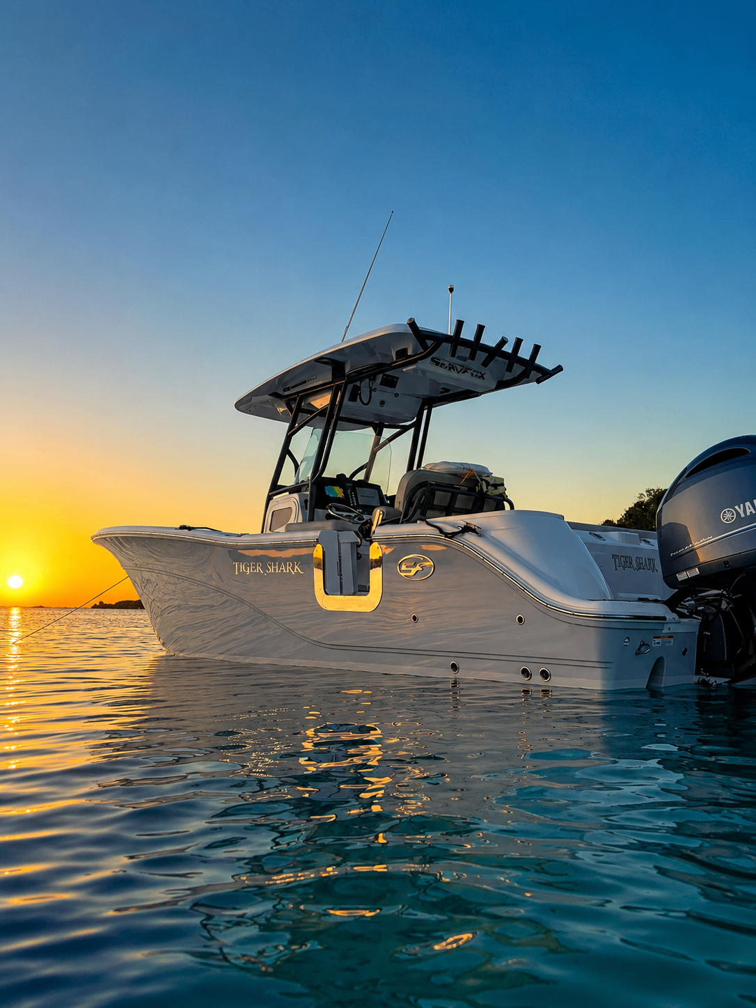 Gammy's Water Tours boat drifting at sunset on calm Caribbean water