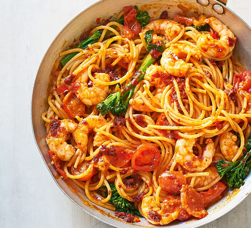 Rolls of Heaven — a vibrant skillet of prawn and harissa spaghetti with broccolini and cherry tomatoes